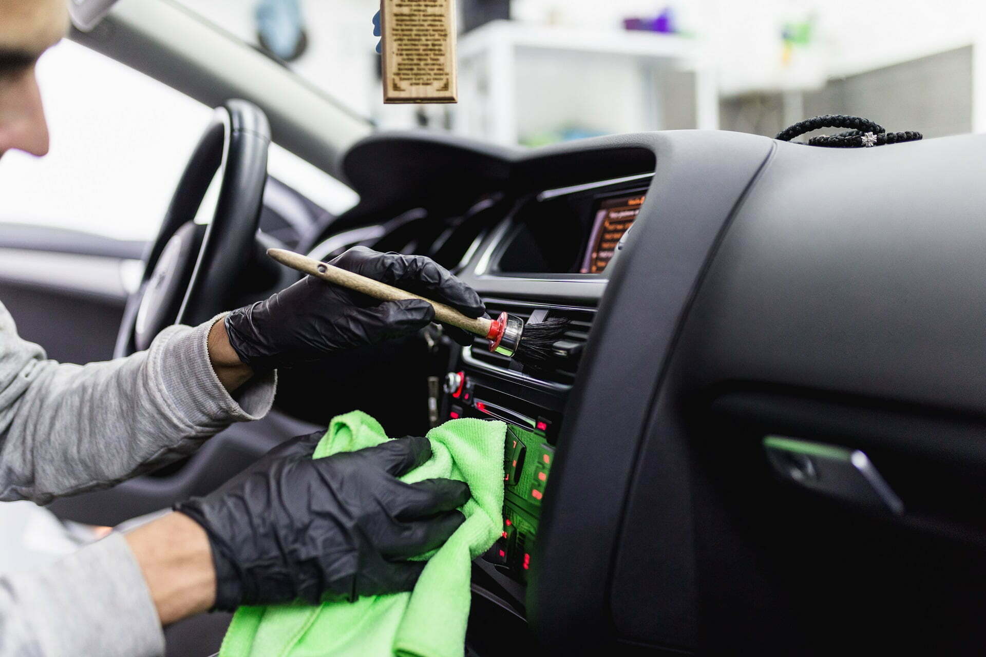 man cleaning car interior at luxe detailing pro in anaheim california